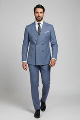 Man wearing light blue double-breasted suit, perfect for weddings and upscale events.
